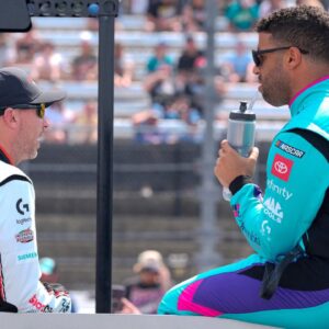 NASCAR Cup Series driver Denny Hamlin (11) chats with driver Bubba Wallace (23) during pre race intros during the Goodyear 400 at Darlington Raceway.