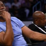 Magic Johnson attends a WNBA game between the Los Angeles Sparks and the Minnesota Lynx at Crypto.com Arena.