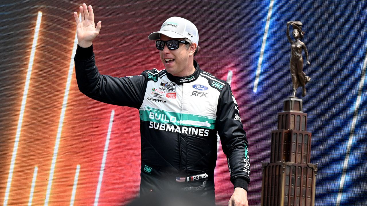 NASCAR Cup Series driver Brad Keselowski (6) greets the crowd during driver introductions before the start of the FireKeepers Casino 400 at Michigan International Speedway.