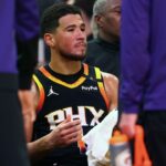 Phoenix Suns guard Devin Booker (1) reacts on the bench against the Oklahoma City Thunder during the second half at Footprint Center.