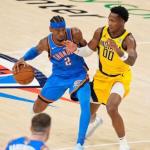 Oklahoma City Thunder guard Shai Gilgeous-Alexander (2) dribbles the ball against Indiana Pacers guard Bennedict Mathurin (00) during the second half during game two of the 2025 NBA Finals at Paycom Center.