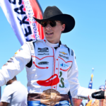 May 4, 2025; Fort Worth, Texas, USA; NASCAR Cup Series driver Carson Hocevar (77) is introduced before the start of the Wurth 400 race at Texas Motor Speedway. Mandatory Credit: Jerome Miron-Imagn Images