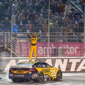 NASCAR Cup Series driver Christopher Bell (20) does his celebratory waves at the crowd after claiming a victory at Atlanta Motor Speedway.