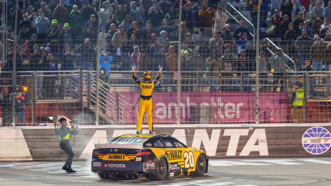 NASCAR Cup Series driver Christopher Bell (20) does his celebratory waves at the crowd after claiming a victory at Atlanta Motor Speedway.