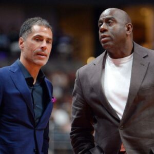 Los Angeles Lakers general manager Rob Pelinka speaks with president of basketball operations Magic Johnson at Honda Center.