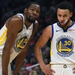 Golden State Warriors guard Stephen Curry (30) and forward Kevin Durant (35) react in the first half of game six of the first round of the 2019 NBA Playoffs against the LA Clippers at Staples Center.