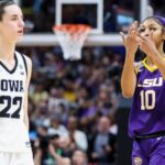 Apr 2, 2023; Dallas, TX, USA; LSU Lady Tigers forward Angel Reese (10) gestures towards Iowa Hawkeyes guard Caitlin Clark (22) after the final round of the Women's Final Four NCAA tournament at the American Airlines Center.