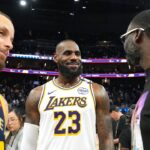 Jan 25, 2025; San Francisco, California, USA; Los Angeles Lakers forward LeBron James (23) talks with Golden State Warriors guard Stephen Curry (30) and forward Draymond Green (right) after the game at Chase Center. Mandatory Credit: Darren Yamashita-Imagn Images