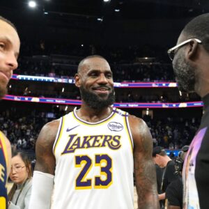 Jan 25, 2025; San Francisco, California, USA; Los Angeles Lakers forward LeBron James (23) talks with Golden State Warriors guard Stephen Curry (30) and forward Draymond Green (right) after the game at Chase Center. Mandatory Credit: Darren Yamashita-Imagn Images