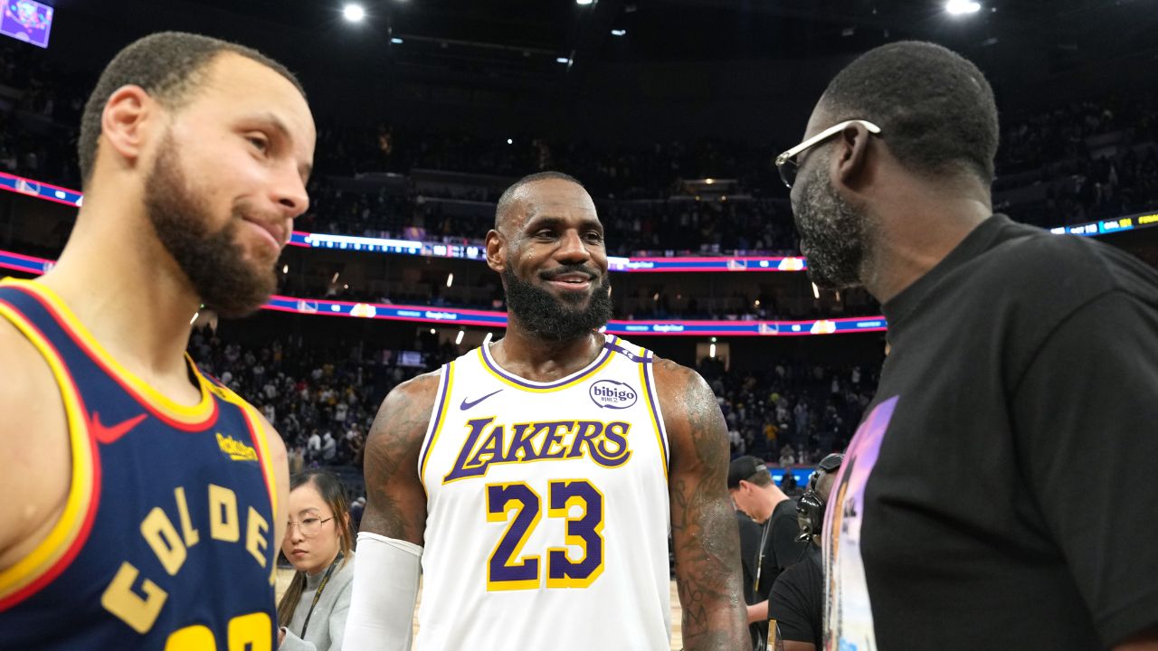 Jan 25, 2025; San Francisco, California, USA; Los Angeles Lakers forward LeBron James (23) talks with Golden State Warriors guard Stephen Curry (30) and forward Draymond Green (right) after the game at Chase Center. Mandatory Credit: Darren Yamashita-Imagn Images