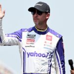 NASCAR Cup Series driver Denny Hamlin (11) greets the crowd during driver introductions before the start of the FireKeepers Casino 400 at Michigan International Speedway.
