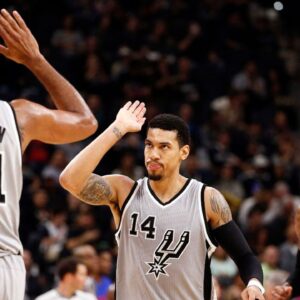 San Antonio Spurs shooting guard Danny Green (14) celebrates with power forward Tim Duncan (21) after hitting a three point shot during the second half against the Philadelphia 76ers at AT&T Center.