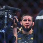Islam Makhachev (red gloves) celebrates defeating Dustin Poirier (blue gloves) during UFC 302 at Prudential Center.