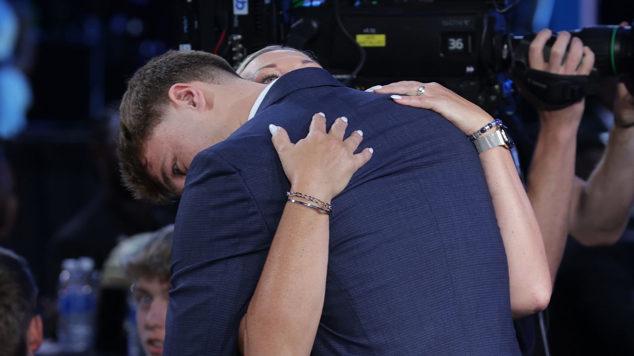 Cooper Flagg embraces his mom Kelly Flagg after being selected as first overall by the Dallas Mavericks in the first round of the 2025 NBA Draft at Barclays Center.