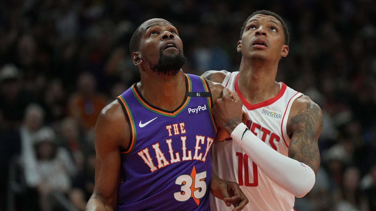 Mar 30, 2025; Phoenix, Arizona, USA; Phoenix Suns forward Kevin Durant (35) and Houston Rockets forward Jabari Smith Jr. (10) fight for position in the first half at Footprint Center. Mandatory Credit: Rick Scuteri-Imagn Images