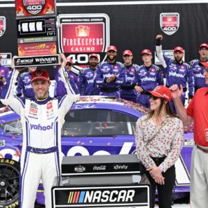 NASCAR Cup Series driver Denny Hamlin (11) crosses the finish line to win the FireKeepers Casino 400 at Michigan International Speedway.