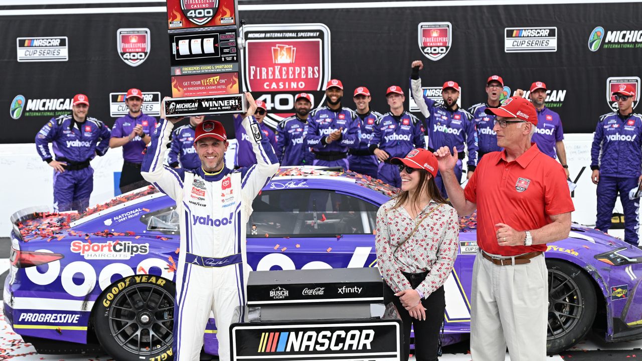 NASCAR Cup Series driver Denny Hamlin (11) crosses the finish line to win the FireKeepers Casino 400 at Michigan International Speedway.