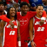 Dec 19, 2024; Memphis, Tennessee, USA; Memphis Grizzlies guard Ja Morant (left), forward Jaren Jackson Jr. (middle) and guard Desmond Bane (right) react during the fourth quarter against the Golden State Warriors at FedExForum. Mandatory Credit: Petre Thomas-Imagn Images