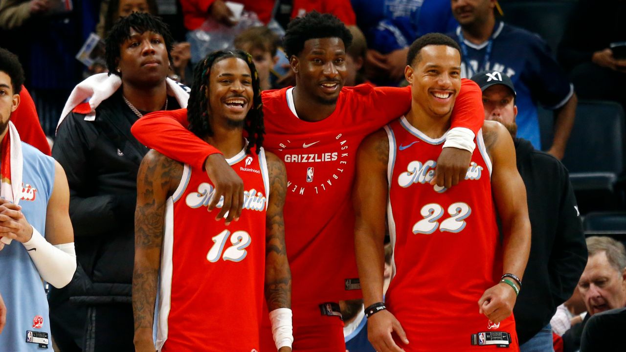 Dec 19, 2024; Memphis, Tennessee, USA; Memphis Grizzlies guard Ja Morant (left), forward Jaren Jackson Jr. (middle) and guard Desmond Bane (right) react during the fourth quarter against the Golden State Warriors at FedExForum. Mandatory Credit: Petre Thomas-Imagn Images