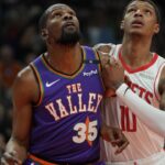 Phoenix Suns forward Kevin Durant (35) and Houston Rockets forward Jabari Smith Jr. (10) fight for position in the first half at Footprint Center.