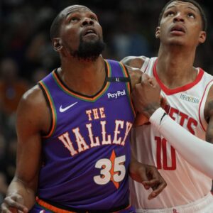Phoenix Suns forward Kevin Durant (35) and Houston Rockets forward Jabari Smith Jr. (10) fight for position in the first half at Footprint Center.