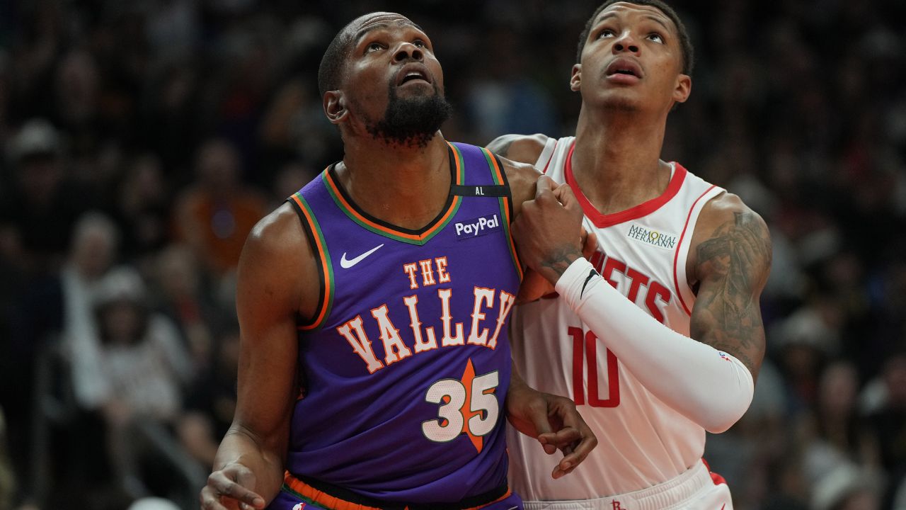Phoenix Suns forward Kevin Durant (35) and Houston Rockets forward Jabari Smith Jr. (10) fight for position in the first half at Footprint Center.
