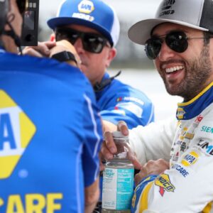 NASCAR Cup Series driver Chase Elliott (right) talks with members of his crew during practice and qualifying for The Great American Getaway 400 at Pocono Raceway.