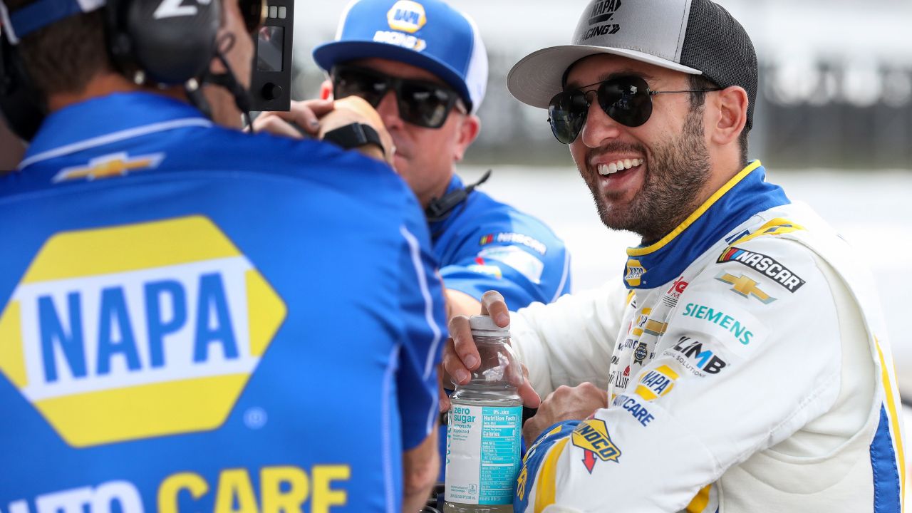 NASCAR Cup Series driver Chase Elliott (right) talks with members of his crew during practice and qualifying for The Great American Getaway 400 at Pocono Raceway.
