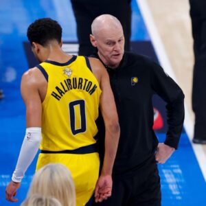 Jun 16, 2025; Oklahoma City, Oklahoma, USA; Indiana Pacers guard Tyrese Haliburton (0) comes off the floor past head coach Rick Carlisle in the first quarter against the Oklahoma City Thunder during game five of the 2025 NBA Finals at Paycom Center. Mandatory Credit: Alonzo Adams-Imagn Images