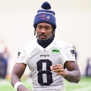 New England Patriots wide receiver Stefon Diggs (8) walks to the podium to speak to the media after minicamp held in the WIN Field House at Gillette Stadium.