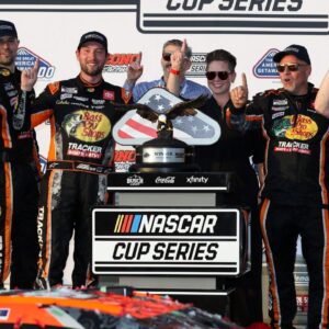 NASCAR Cup Series driver Chase Briscoe celebrates with his team in victory lane after winning The Great American Getaway 400 at Pocono Raceway.