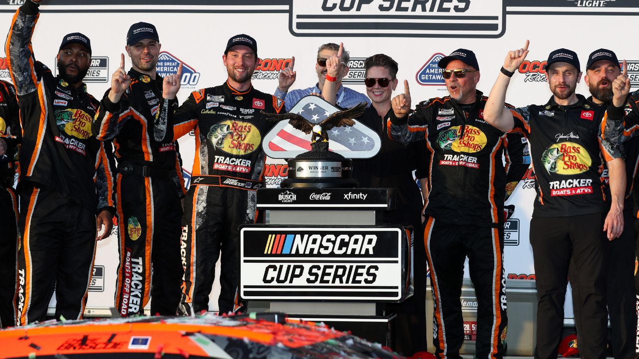 NASCAR Cup Series driver Chase Briscoe celebrates with his team in victory lane after winning The Great American Getaway 400 at Pocono Raceway.