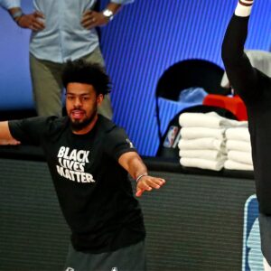 Aug 29, 2020; Lake Buena Vista, Florida, USA; Los Angeles Lakers forward LeBron James (23) celebrates with guard Quinn Cook (28) before playing the Portland Trail Blazers in game five of the first round of the 2020 NBA Playoffs at AdventHealth Arena.