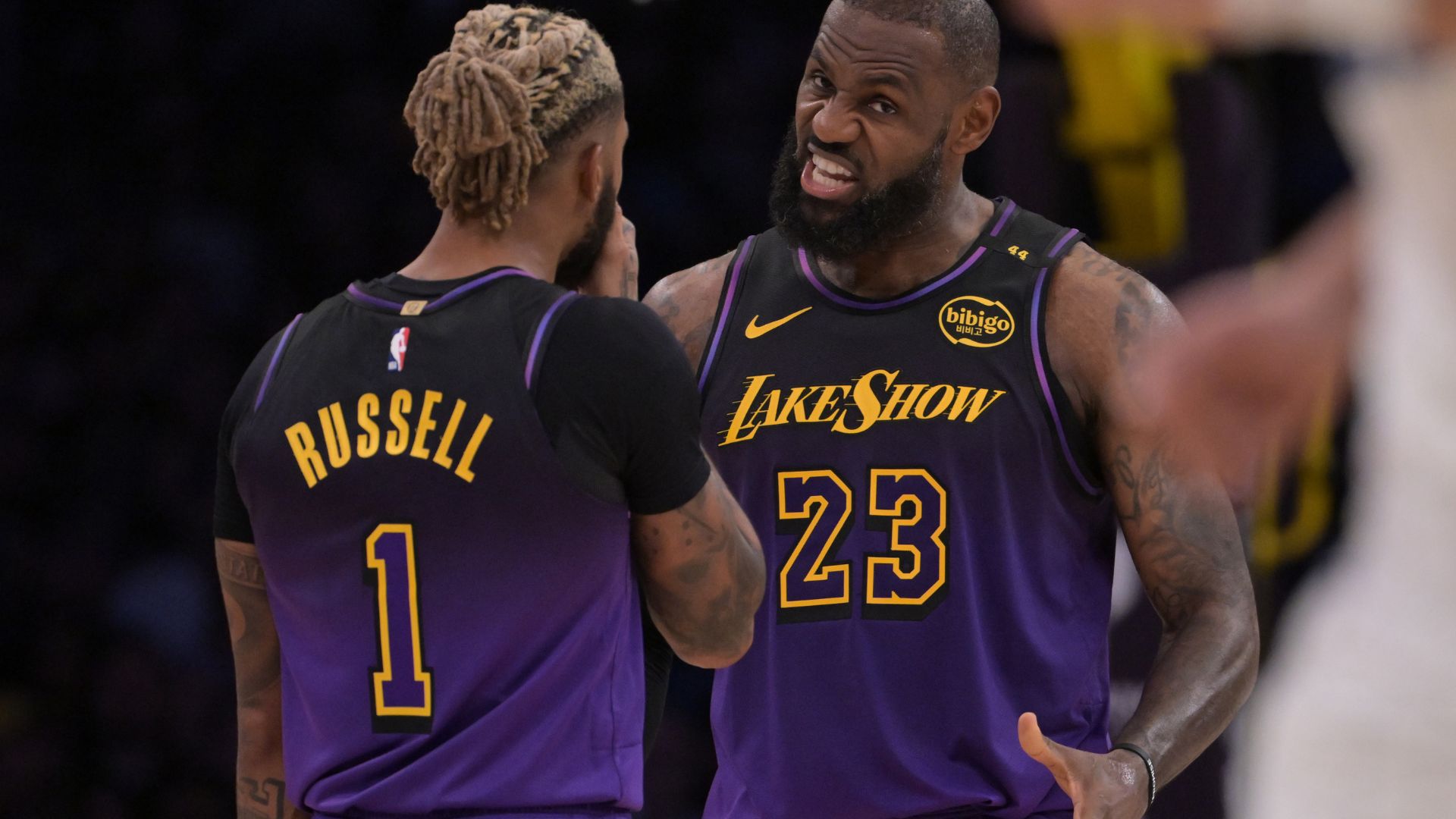 Nov 21, 2024; Los Angeles, California, USA; Los Angeles Lakers guard D'Angelo Russell (1) and forward LeBron James (23) talk on the court during a stoppage in play against the Orlando Magic at Crypto.com Arena