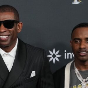 Deion Sanders with his sons Shedeur Sanders (left) and Deion Sanders Jr. (right) on the red carpet before Super Bowl LIX NFL Honors at Saenger Theatre.