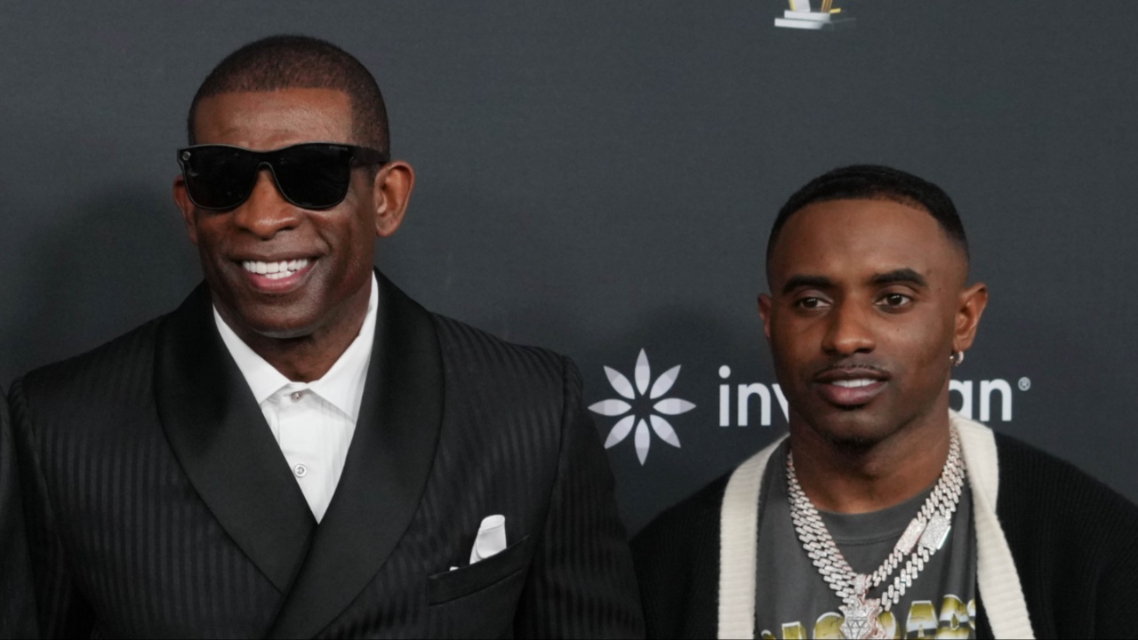 Deion Sanders with his sons Shedeur Sanders (left) and Deion Sanders Jr. (right) on the red carpet before Super Bowl LIX NFL Honors at Saenger Theatre.