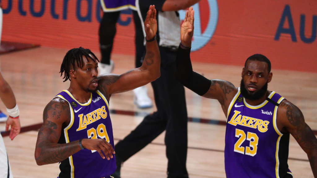 Los Angeles Lakers center Dwight Howard (39) and forward LeBron James (23) celebrate