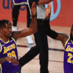 Los Angeles Lakers center Dwight Howard (39) and forward LeBron James (23) celebrate