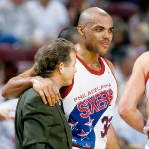 Philadelphia 76ers forward Charles Barkley (32) hugs coach Jim Lynam (left) against the Chicago Bulls at the Spectrum.