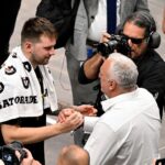 Los Angeles Lakers guard Luka Doncic (77) hugs his father Sasa Doncic after the game against the Dallas Mavericks at the American Airlines Center.