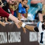 Carolina Panthers quarterback Cam Newton (1) celebrates with fans after defeating the Arizona Cardinals at State Farm Stadium.