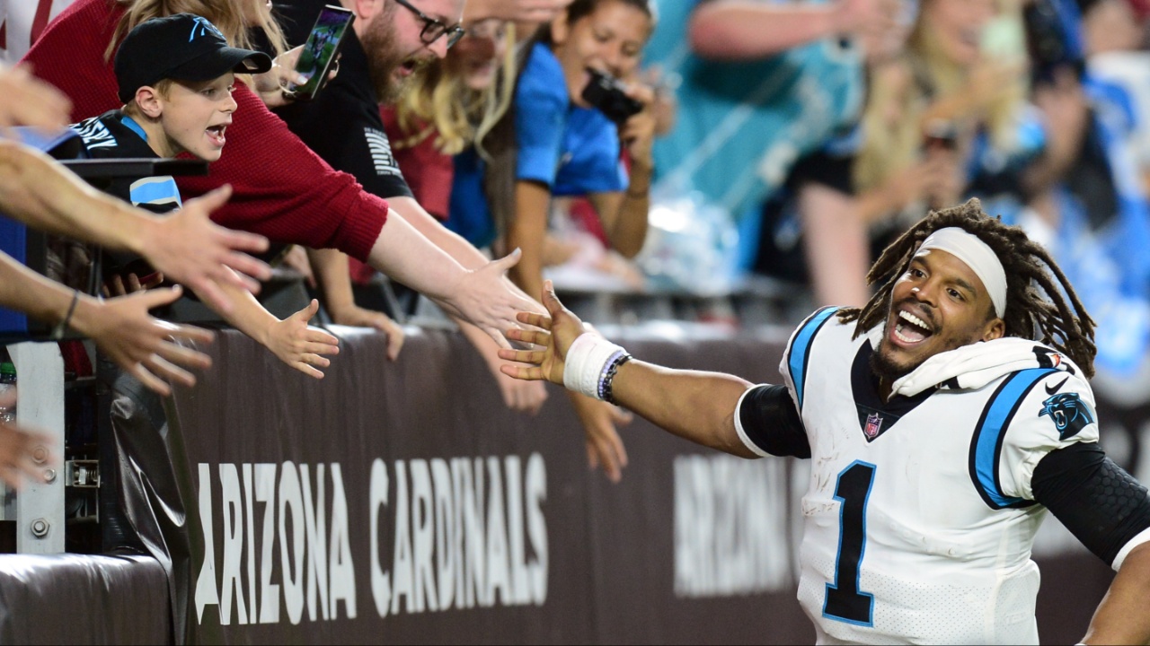 Carolina Panthers quarterback Cam Newton (1) celebrates with fans after defeating the Arizona Cardinals at State Farm Stadium.