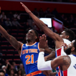Nov 27, 2018; Detroit, MI, USA; New York Knicks guard Damyean Dotson (21) goes to the basket on Detroit Pistons guard Langston Galloway (9) and center Andre Drummond (0) in the second half at Little Caesars Arena. Mandatory Credit: Rick Osentoski-Imagn Images