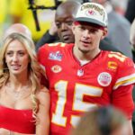 Kansas City Chiefs quarterback Patrick Mahomes (15) and his wife Brittany Mahomes walk off the field after winning Super Bowl LVIII against the San Francisco 49ers at Allegiant Stadium.