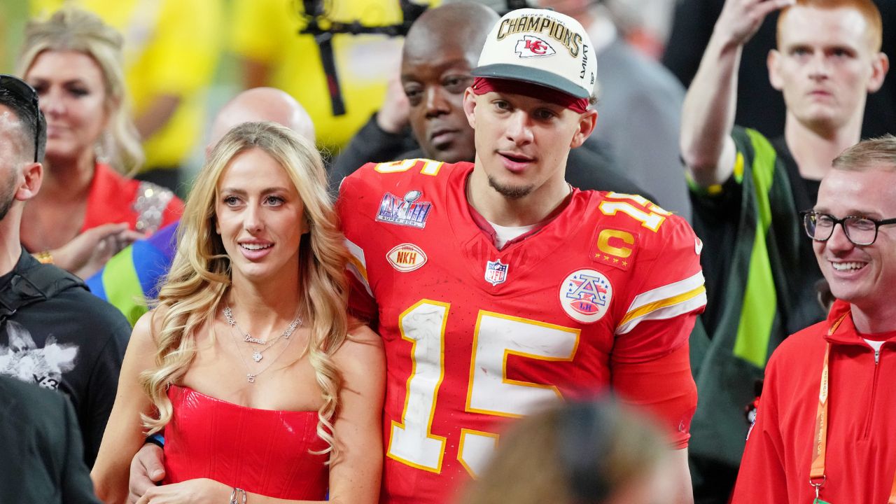 Kansas City Chiefs quarterback Patrick Mahomes (15) and his wife Brittany Mahomes walk off the field after winning Super Bowl LVIII against the San Francisco 49ers at Allegiant Stadium.