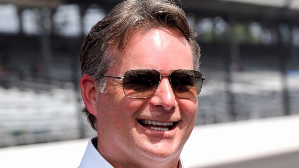 Inaugural Brickyard 400 winner Jeff Gordon stands on the track with other drivers from the first race Sunday, July 21, 2024, ahead of the Brickyard 400 at Indianapolis Motor Speedway.