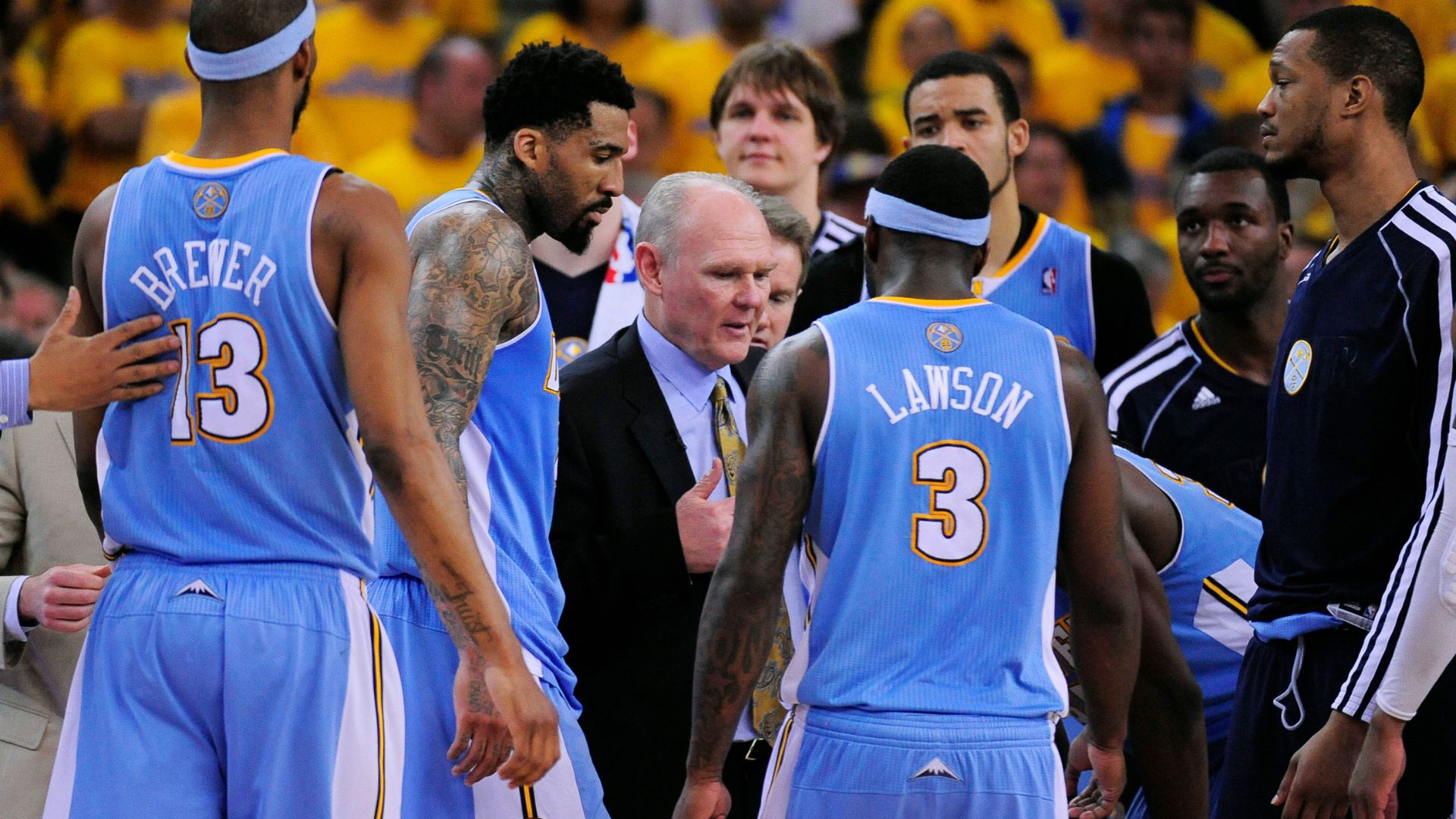 May 2, 2013; Oakland, CA, USA; Denver Nuggets head coach George Karl instructs in a huddle against the Golden State Warriors during the fourth quarter of game six of the first round of the 2013 NBA Playoffs at Oracle Arena. The Warriors defeated the Nuggets 92-88.