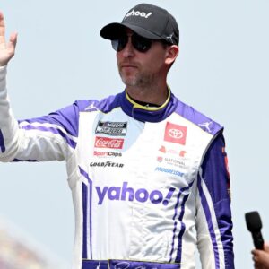 NASCAR Cup Series driver Denny Hamlin (11) greets the crowd during driver introductions before the start of the FireKeepers Casino 400 at Michigan International Speedway.
