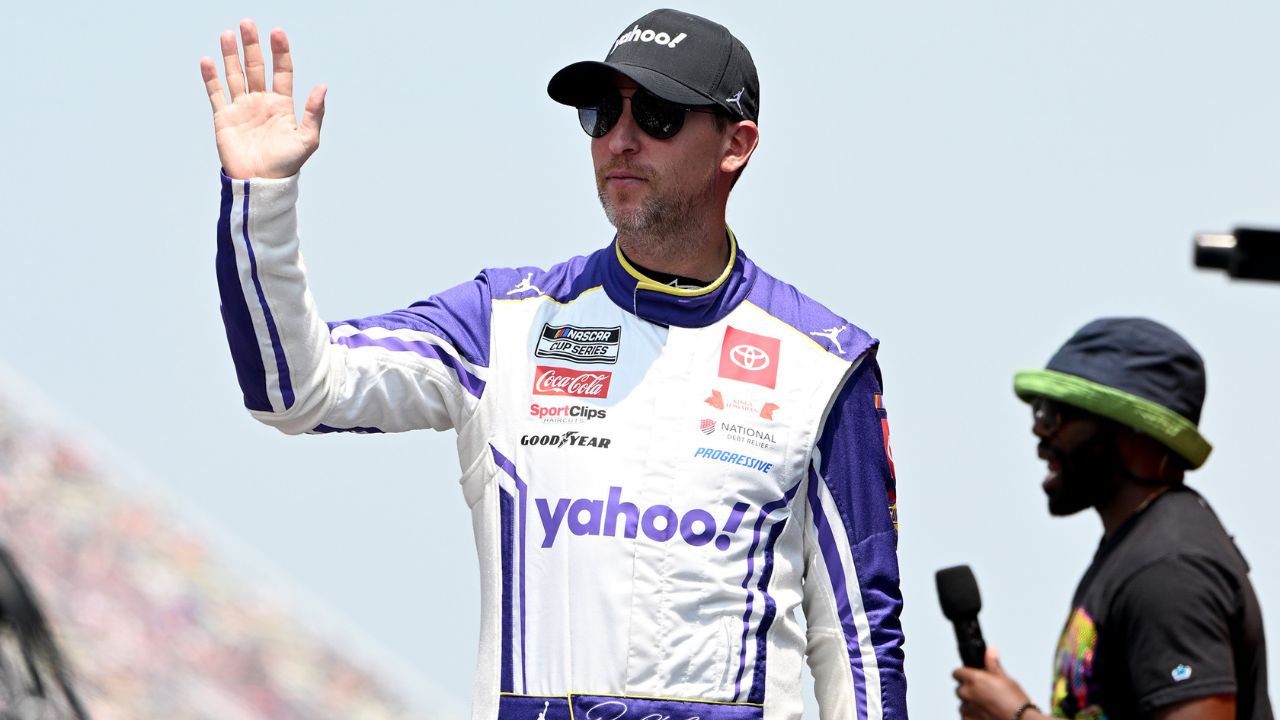 NASCAR Cup Series driver Denny Hamlin (11) greets the crowd during driver introductions before the start of the FireKeepers Casino 400 at Michigan International Speedway.
