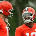 Cleveland Browns quarterback Joe Flacco, left, chats with rookie Shedeur Sanders during an NFL practice at the Cleveland Browns training facility on Wednesday, May 28, 2025, in Berea, Ohio.